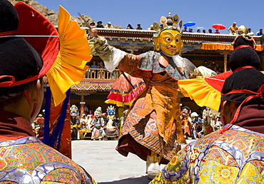 Monk in wooden mask in traditional costume, dancing in monastery courtyard, Hemis Festival, Hemis, Ladakh, India, Asia