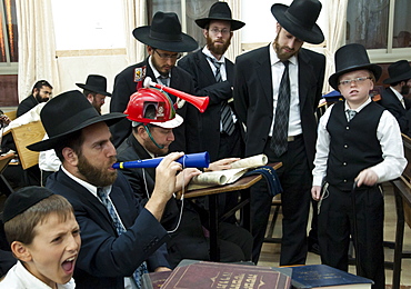 When Haman's name is read out during the public chanting of the Megillah in the synagogue, which occurs 54 times, the congregation engages in noisemaking to blot out his name, Purim Festival, Ramat Beit Shemesh, Israel, Middle East