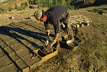 Man making clay bricks for his house, Kurdistan, Anatolia, Turkey, Asia Minor, Eurasia