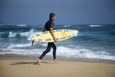 Man going surfing, Otway National Park, Victoria, Australia, Pacific