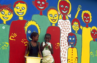 Portrait of two children against a mural at Jeffreys Bay, Humansdorp, South Africa, Africa