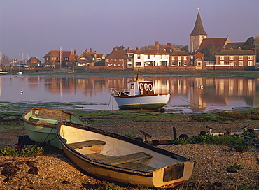 Boats in Bosham from across the tidal creek in early morning, on one of the small inlets of Chichester Harbour, Bosham, West Sussex, England, United Kingdom, Europe