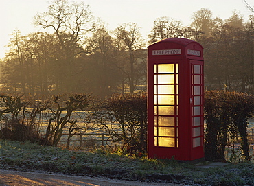 Red telephone box, on a frosty morning in early light, Snelston, Hartington, Derbyshire, England, United Kingdom, Europe