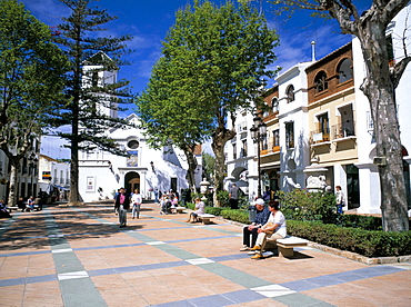 People relaxing in Church Square in front of the El Salvador church near the Balcon de Europa promenade, Nerja, Malaga, Andalucia (Andalusia), Spain, Europe