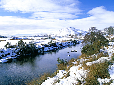 The Glenmore River in Galltair, with snow on the ground and mountains of Skye in later winter, Glenelg, Highland region, Scotland, United Kingdom, Europe