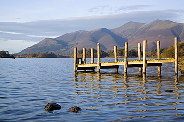 Wooden jetty at Barrow Bay landing on Derwent Water looking north to Skiddaw in autumn, Keswick, Lake District National Park, Cumbria, England, United Kingdom, Europe