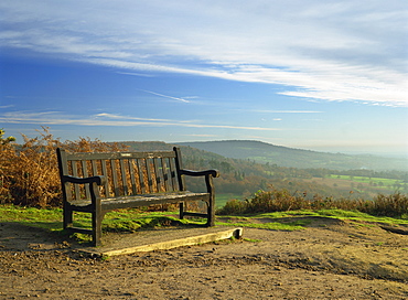 Bench on Pitch Hill, with view along the Greensand Ridge to Holmbury Hill and Leith Hill, Pitch Hill, Ewhurst, Surrey, England, United Kingdom, Europe