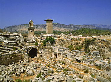 The theatre, with Lycean tombs in the background, Xanthos, UNESCO World Heritage Site, Anatolia, Turkey, Asia Minor, Eurasia