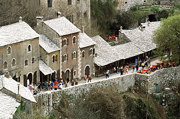 Stone tiled colour washed houses in the Street of Craftsmen, Mostar, Bosnia, Europe