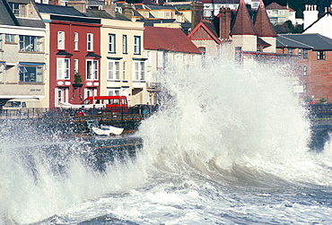 Waves pounding sea wall and rail track in storm, Dawlish, Devon, England, United Kingdom, Europe