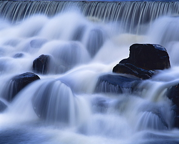 Close-up of waterfall, water cascading over rocks in the Highlands of Scotland, United Kingdom, Europe