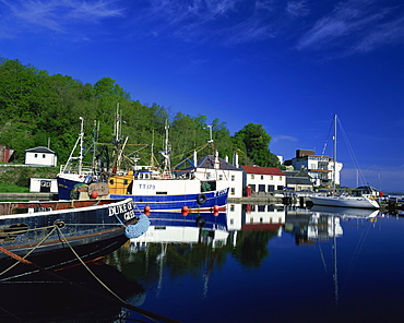 Tranquil scene of boats reflected in still water on the Crinan Canal, Crinan, Strathclyde, Scotland, United Kingdom, Europe