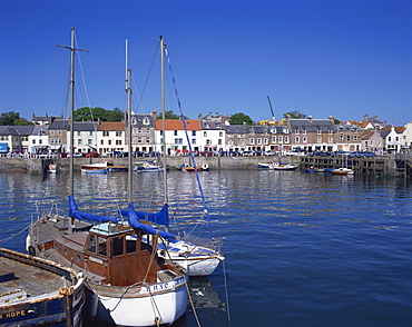 Boats on water and waterfront at Neuk of Fife, Anstruther, Scotland, United Kingdom, Europe