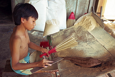 Child labour, portrait of a young boy working in an incense factory on the Mekong River at Chau Doc, Vietnam, Indochina, Southeast Asia, Asia