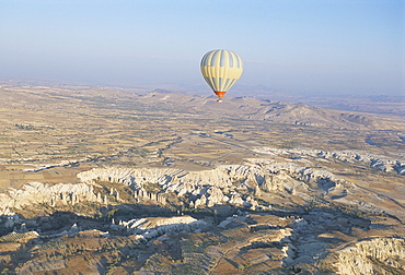 Hot air ballooning over rock formations, Cappadocia, Anatolia, Turkey, Asia Minor, Asia