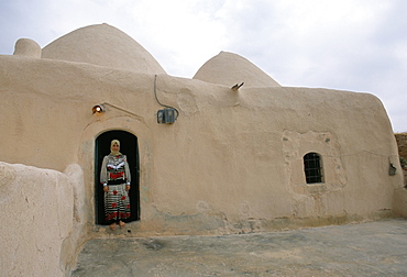 Woman in doorway of a 200 year old beehive house in the desert, Ebla area, Syria, Middle East