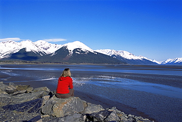 Woman looking at glaciers along the Seward Highway, Girdwood, Alaska, United States of America, North America