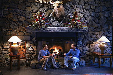 Men beside the fire, The Alyeska Resort, Girdwood, Alaska, United States of America, North America