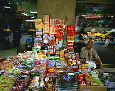 Elderly street trader with his stall in Bangkok, Thailand, Southeast Asia, Asia