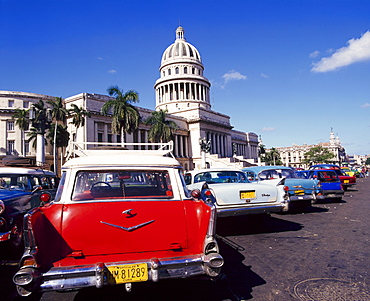 Street scene of taxis parked near the Capitolio Building in Central Havana, Cuba, West Indies 