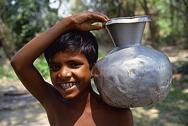 Boy carrying water, Bangladesh, Asia