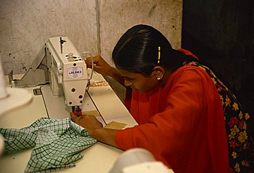 Woman working in garment factory, Dhaka, Bangladesh, Asia