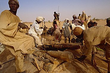 People at well during famine in 1997, Darfur, Sudan, Africa