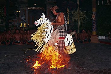 Portrait of a man riding a straw horse, walking on coals during fire dancing at night, Bali, Indonesia, Southeast Asia, Asia