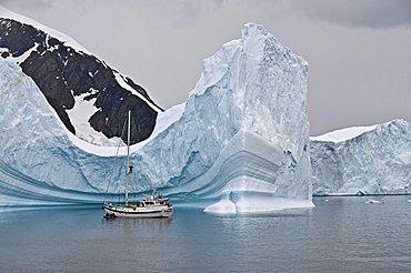 Sailing yacht and iceberg, Errera Channel, Antarctic Peninsula, Antarctica, Polar Regions