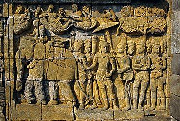 Relief carvings on frieze on outside wall of the Buddhist temple, Borobodur (Borobudur), Java, Indonesia