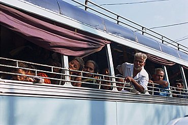 Close-up of a group of Indian people on a bus, road transport, Kerala, India, Asia