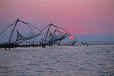 Chinese fishing nets at sunset, Fort Cochin, Kerala state, India, Asia