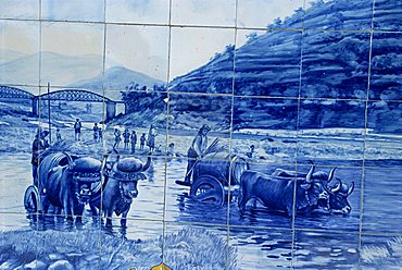 Azulejos showing port barrels on carts, Pinhao railway station, Douro region, Portugal, Europe