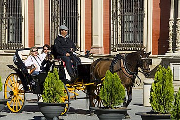 Horse and carriage with Archbishops Palace in background in Santa Cruz district, Seville, Andalusia, Spain, Europe