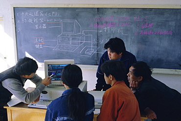 Students at a computer demonstration in a class at a rural school, China, Asia