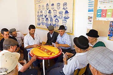 Local men play cards at Aljezur, Algarve, Portugal, Europe