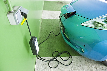 A Nissan Leaf Electric Car being charged at a Car Park in Annecy, France, Europe