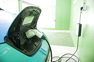 A Nissan Leaf Electric Car being charged at a Car Park in Annecy, France, Europe