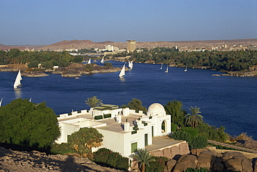 White Begum residence overlooking the River Nile with feluccas, at Aswan, Egypt, North Africa, Africa