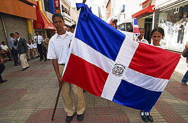 School children marching with flag, Santo Domingo, Dominican Republic, West Indies, Central America