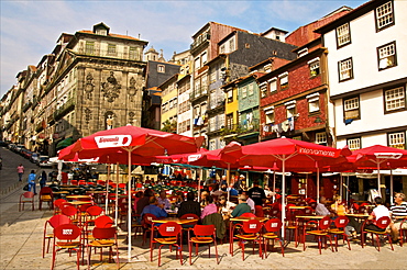 Red sunshades of cafes in Ribeira Square, Porto, Portugal, Europe