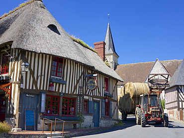 Auberge des Deux Tonneaux (Two Barrels Inn), typical ancient Norman cottage, thatched and half timbered, with tractor, Pierrefitte en Auge, Calvados, Normandy, France, Europe