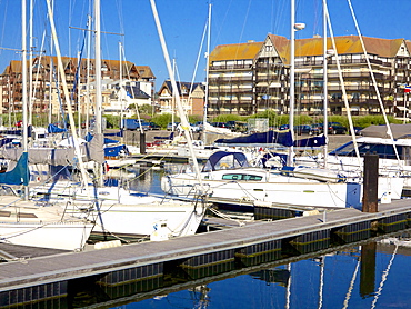 Floating quay and pleasure boats, with contemporary flats in Norman style in the background, Port Deauville, Deauville, Calvados, Normandy, France, Europe