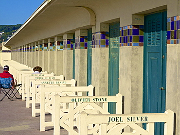 The famous Planches and the cabins of the Pompeian Baths with American actors' names painted, Deauville, Calvados, Normandy, France, Europe