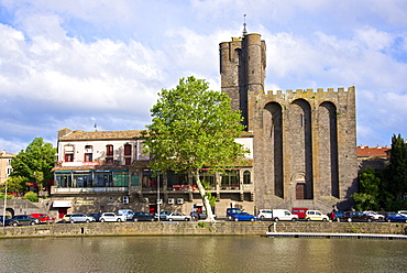 The fortified St. Etienne cathedral built of black lava and dating from the 12th century, and Herault river, Agde town, Haut Languedoc, France, Europe