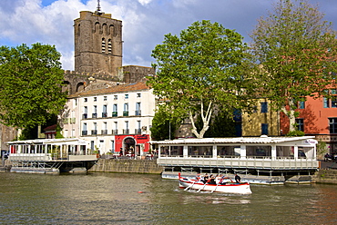 The fortified St. Etienne cathedral built of black lava and dating from the 12th century, and Herault river, Agde town, Haut Languedoc, France, Europe