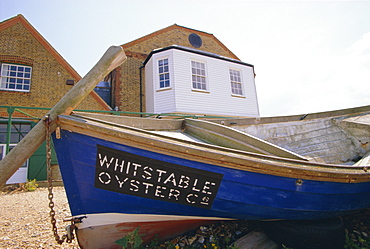 Fishing boat on the beach, Whitstable, Kent, England, UK. Whitstable is popular for it's oyster and fish restaurants. 