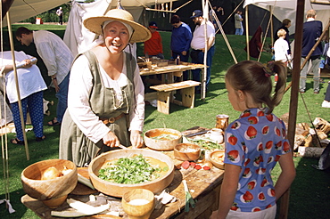 Woman preparing herbs in medieval style, Kenilworth, Warwickshire, England, United Kingdom, Europe