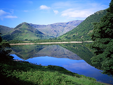 Mountains reflected in still water of the lake, Brothers Water, Lake District, Cumbria, England, United Kingdom, Europe