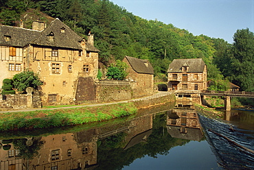 Tranquil scene of reflections in water of a millhouse near Conques, Aveyron, Midi-Pyrenees, France, Europe